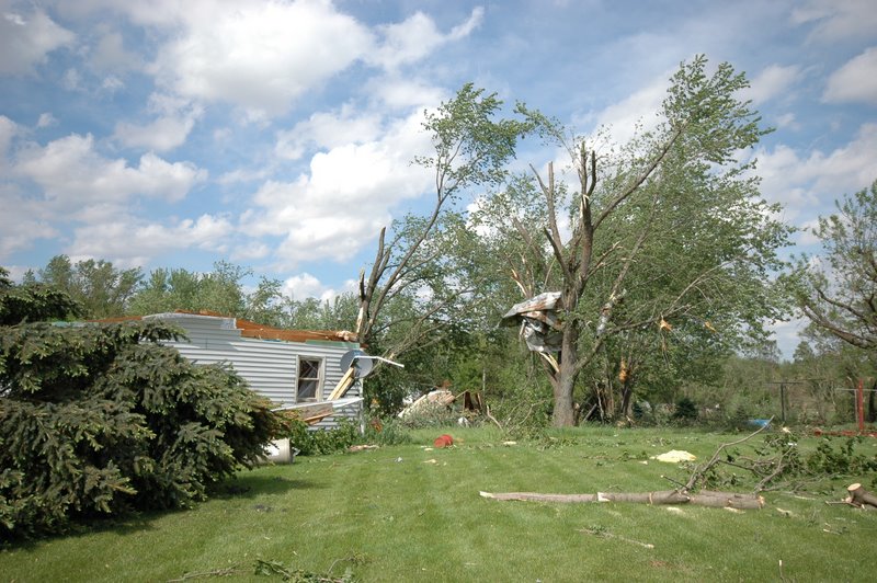 Damage to trees and a manufactured home in Adeline, IL.