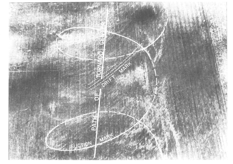 Aerial photograph of typical suction and drift marks left by a tornado on an unplowed field.